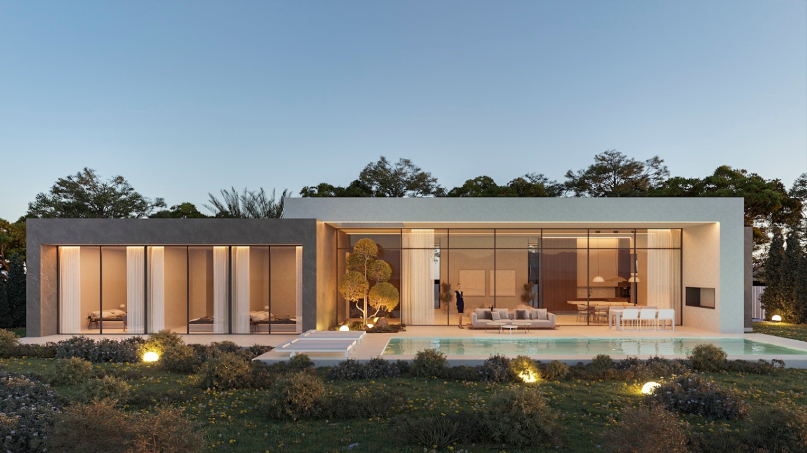 Fachada de diseño contemporáneo con grandes ventanales, piscina de 52 m² y jardín iluminado. Se distinguen los volúmenes de piedra y estuco blanco bajo luz crepuscular.