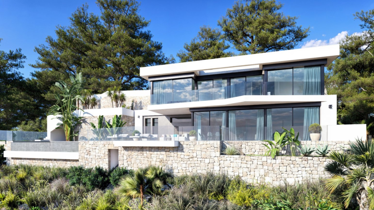 Fachada exterior de la villa con arquitectura de líneas rectas, muros de piedra natural, amplios ventanales y terrazas con barandillas de cristal.