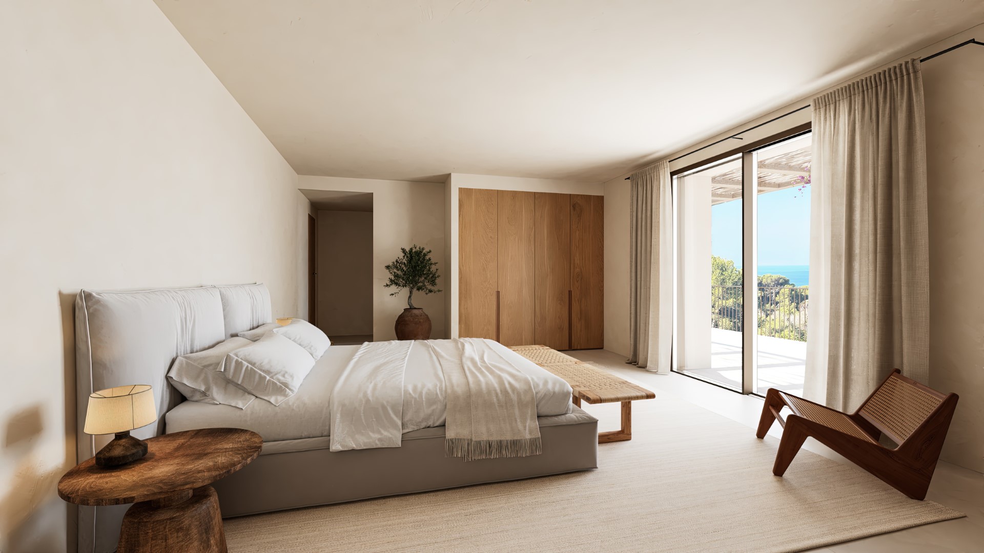 Dormitorio principal con armarios de madera integrados, mobiliario de diseño y acceso directo a una terraza con vistas panorámicas al mar Mediterráneo.