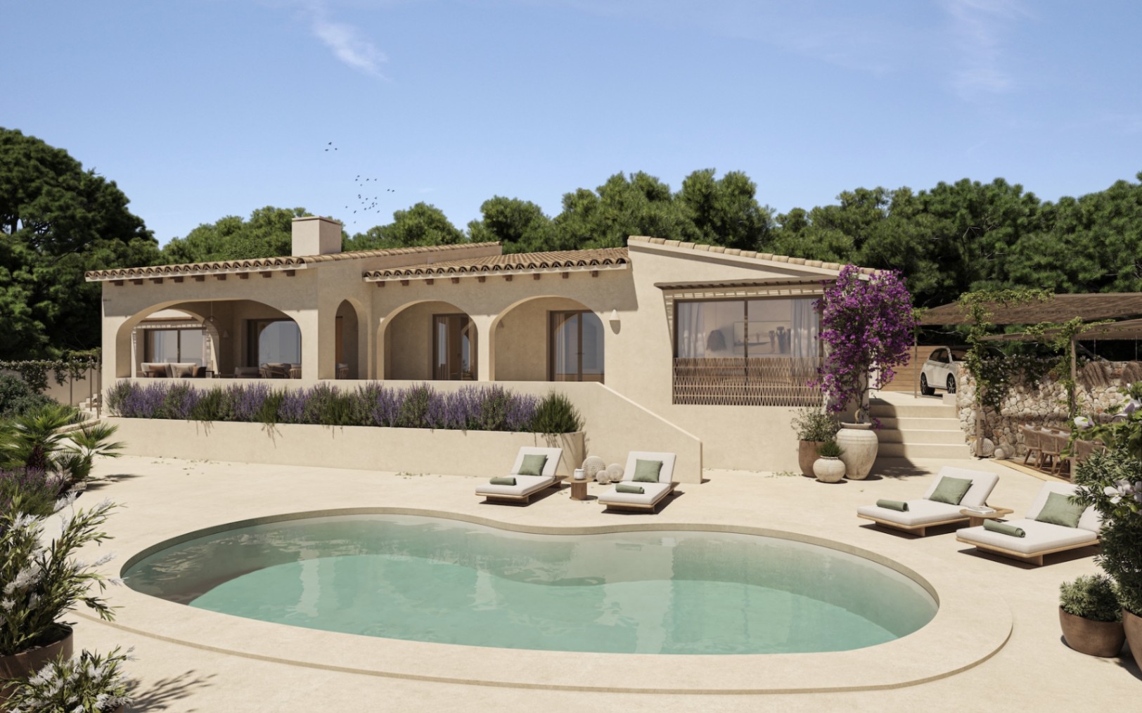 Vista exterior de la villa con piscina de diseño orgánico, amplia terraza soleada y fachada mediterránea con arcos tradicionales y vegetación autóctona.