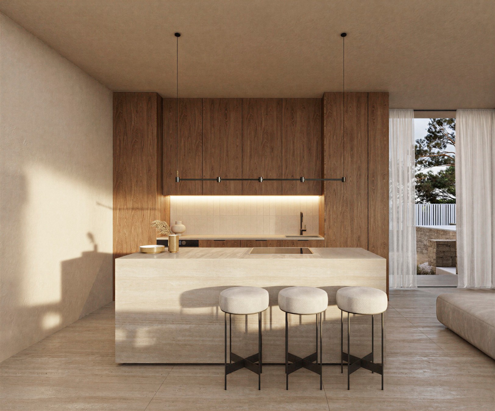 Cocina de diseño con isla de piedra natural, armarios de madera de suelo a techo e iluminación integrada. Incluye taburetes minimalistas y acceso directo a la terraza.