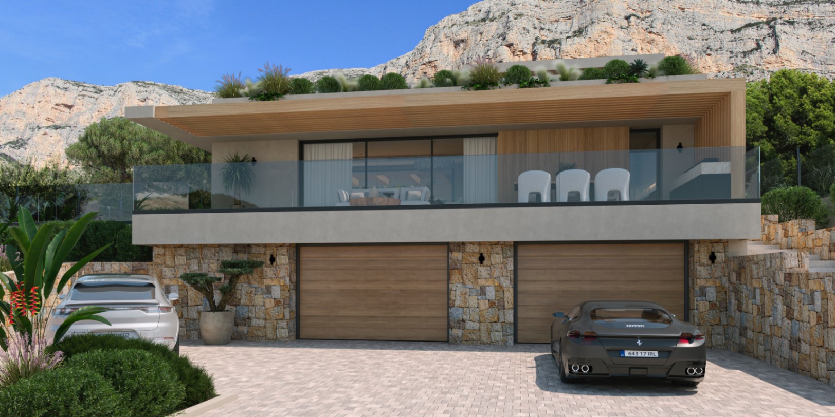 Fachada moderna con garaje doble integrado en muros de piedra natural, amplia terraza superior con barandilla de cristal y vistas directas al macizo del Montgó.