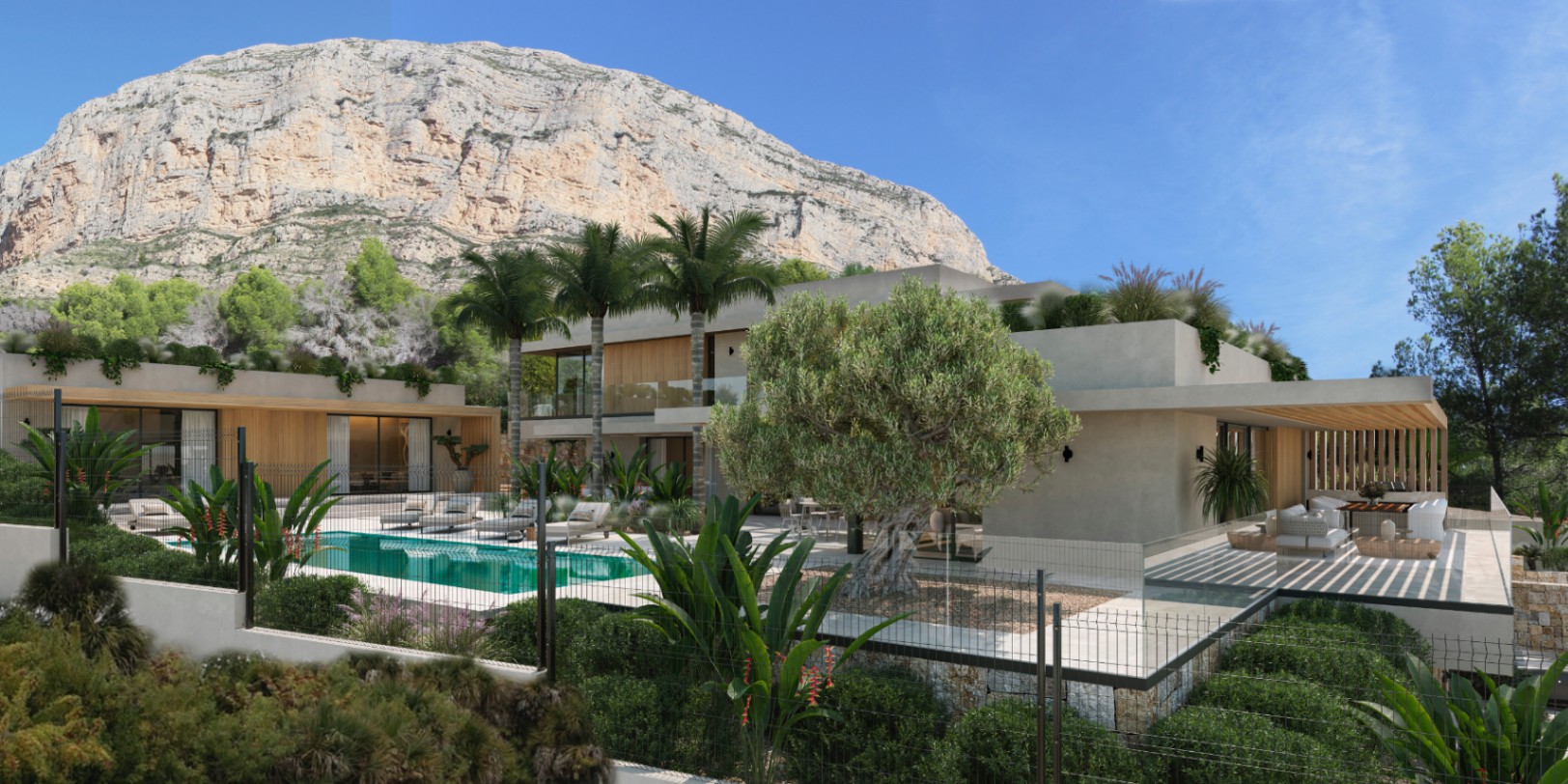 Vista exterior de la villa con piscina turquesa, terraza de piedra y jardín mediterráneo bajo la imponente silueta del monte Montgó en Jávea.