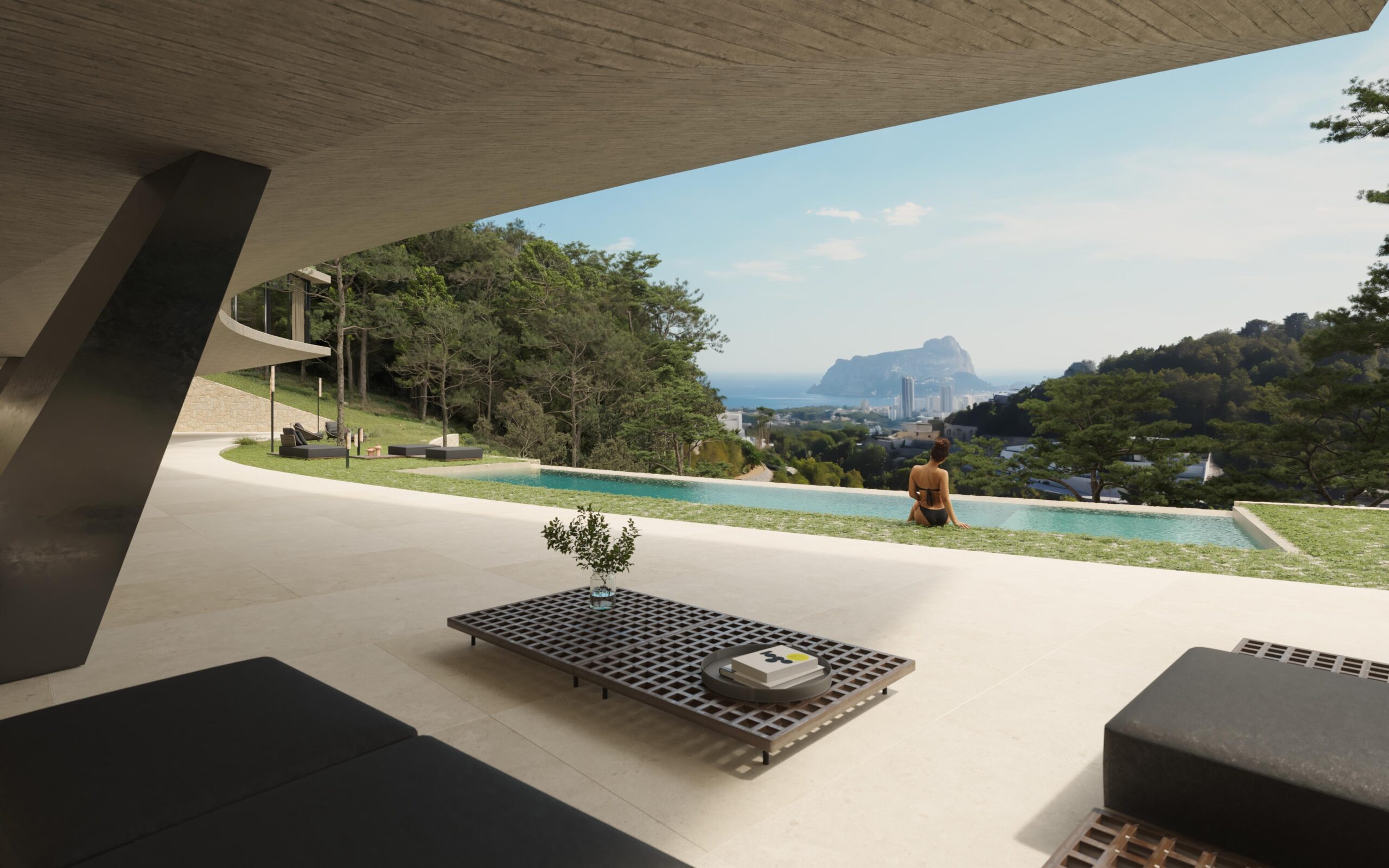 Terraza moderna con techo de hormigón visto, piscina de borde infinito y vistas panorámicas al Peñón de Ifach y la costa mediterránea.
