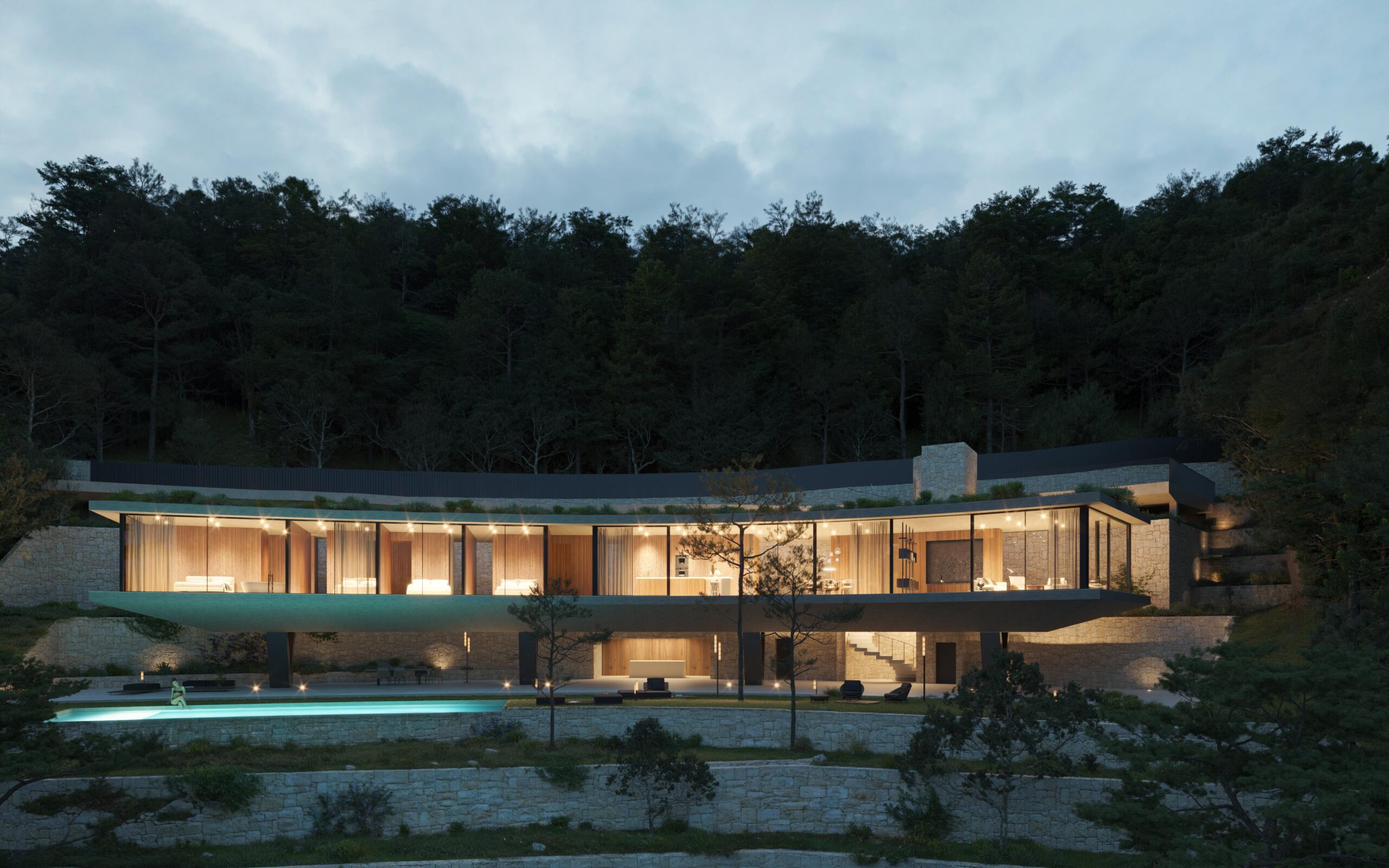 Villa moderna voladiza con fachadas de vidrio e interiores de madera iluminados, integrada en una ladera boscosa con muros de piedra natural y piscina.