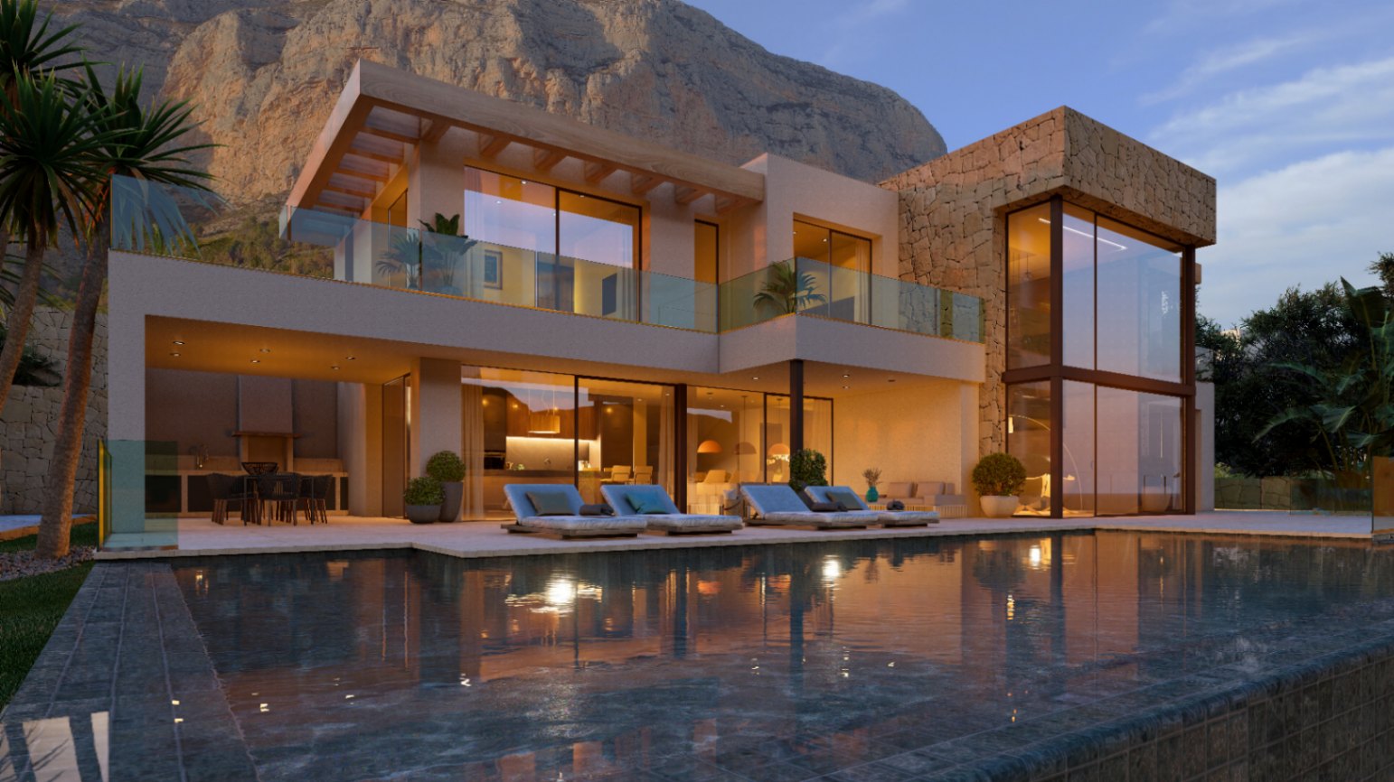 Fachada moderna con piscina frente al Montgó, destacando los grandes ventanales, acabados en piedra natural y una amplia terraza iluminada con zona de comedor exterior.