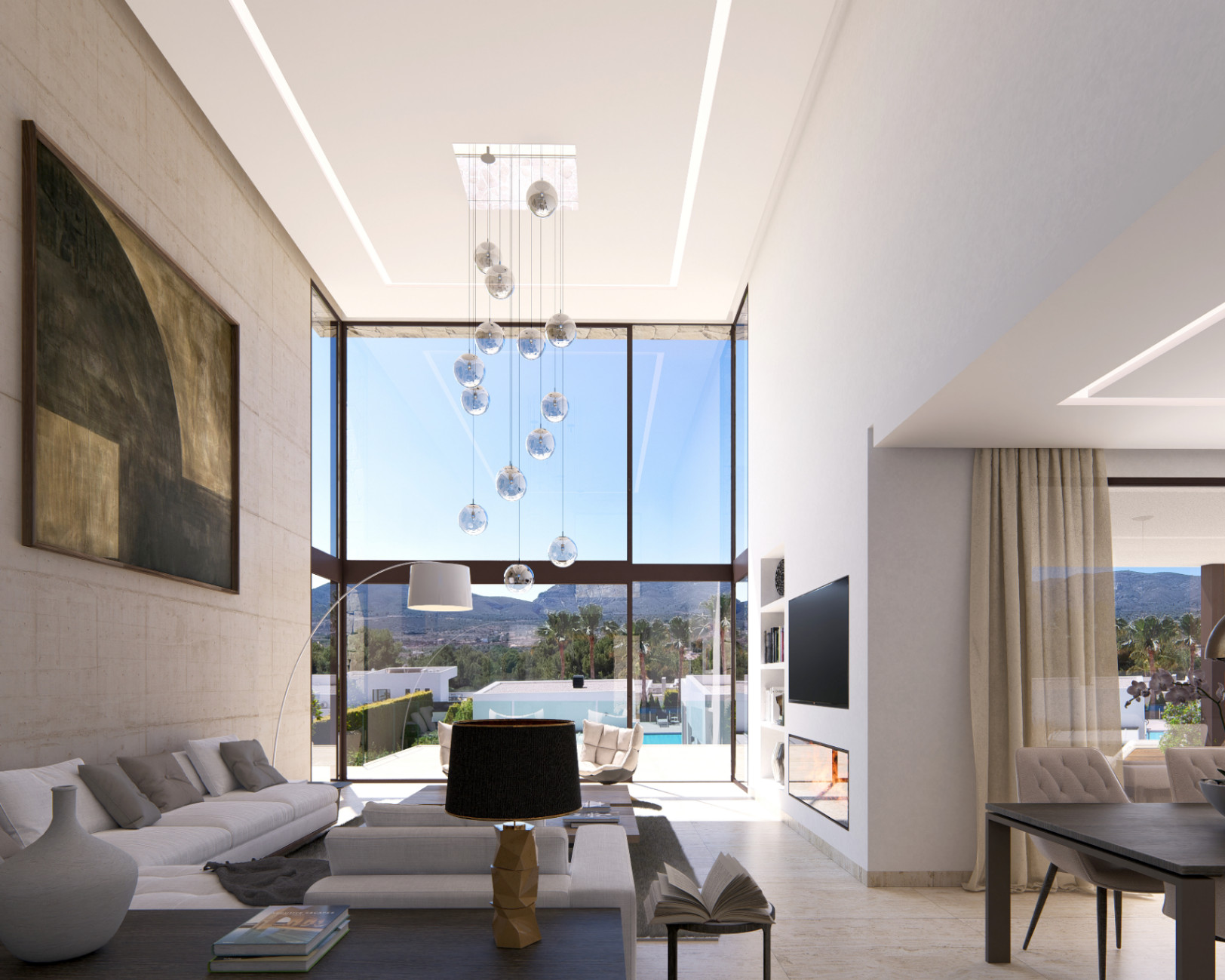 Salón de doble altura con ventanales de 6 metros, pared de piedra natural, lámpara de esferas de cristal y vistas despejadas al Montgó y la piscina.