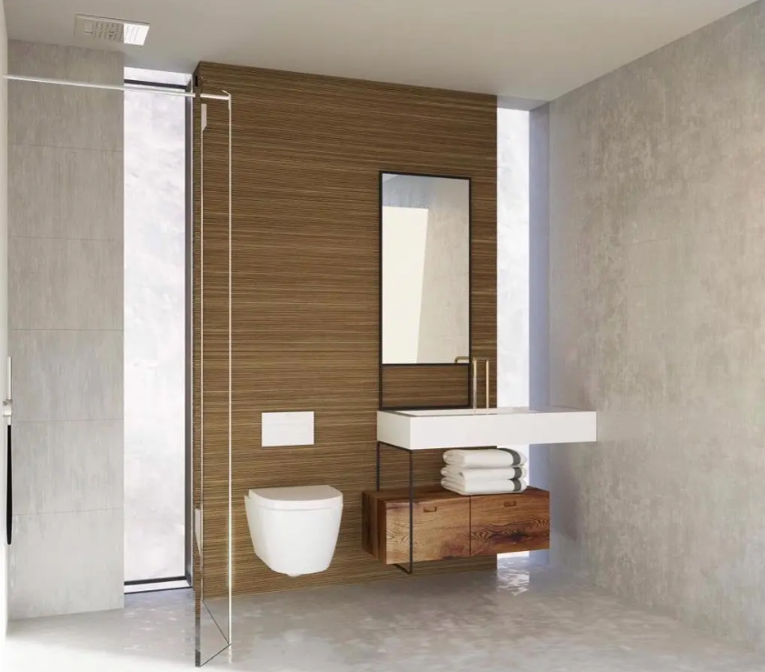 Baño contemporáneo con pared de listones de madera, lavabo suspendido blanco y sanitario de pared. Dispone de mampara de cristal y entrada de luz natural lateral.