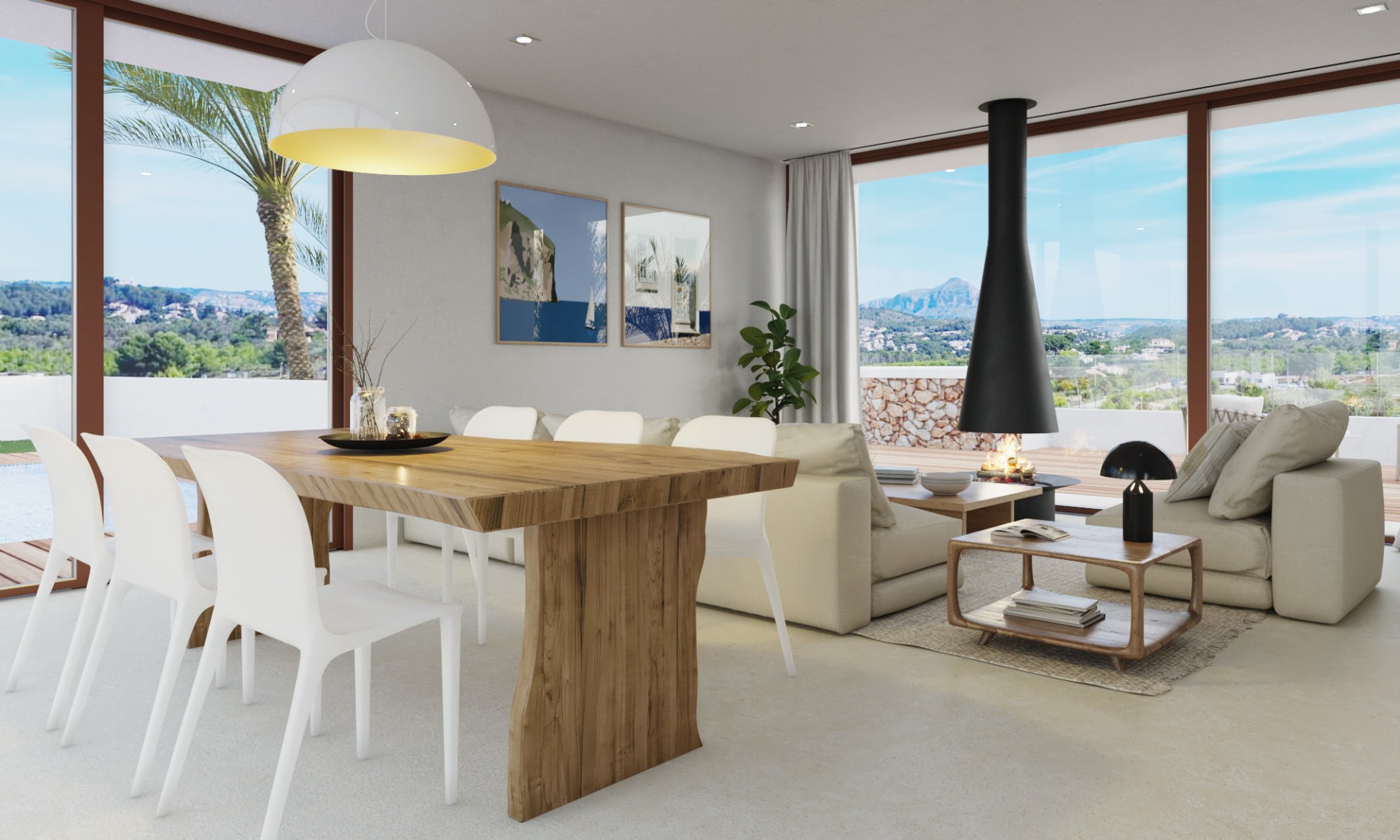Salón-comedor diáfano con mesa de madera maciza, chimenea suspendida de diseño y grandes ventanales con vistas panorámicas al Montgó y al valle.