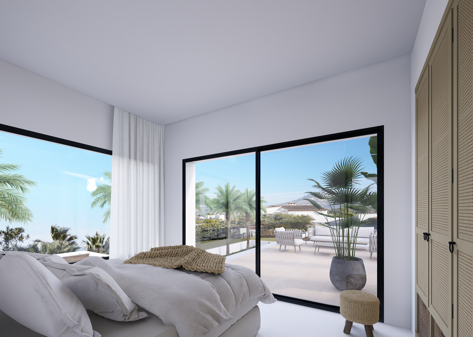 Dormitorio moderno con ventanales de suelo a techo y acceso directo a la terraza. Dispone de armarios empotrados con frontales de ratán y vistas al macizo del Montgó.