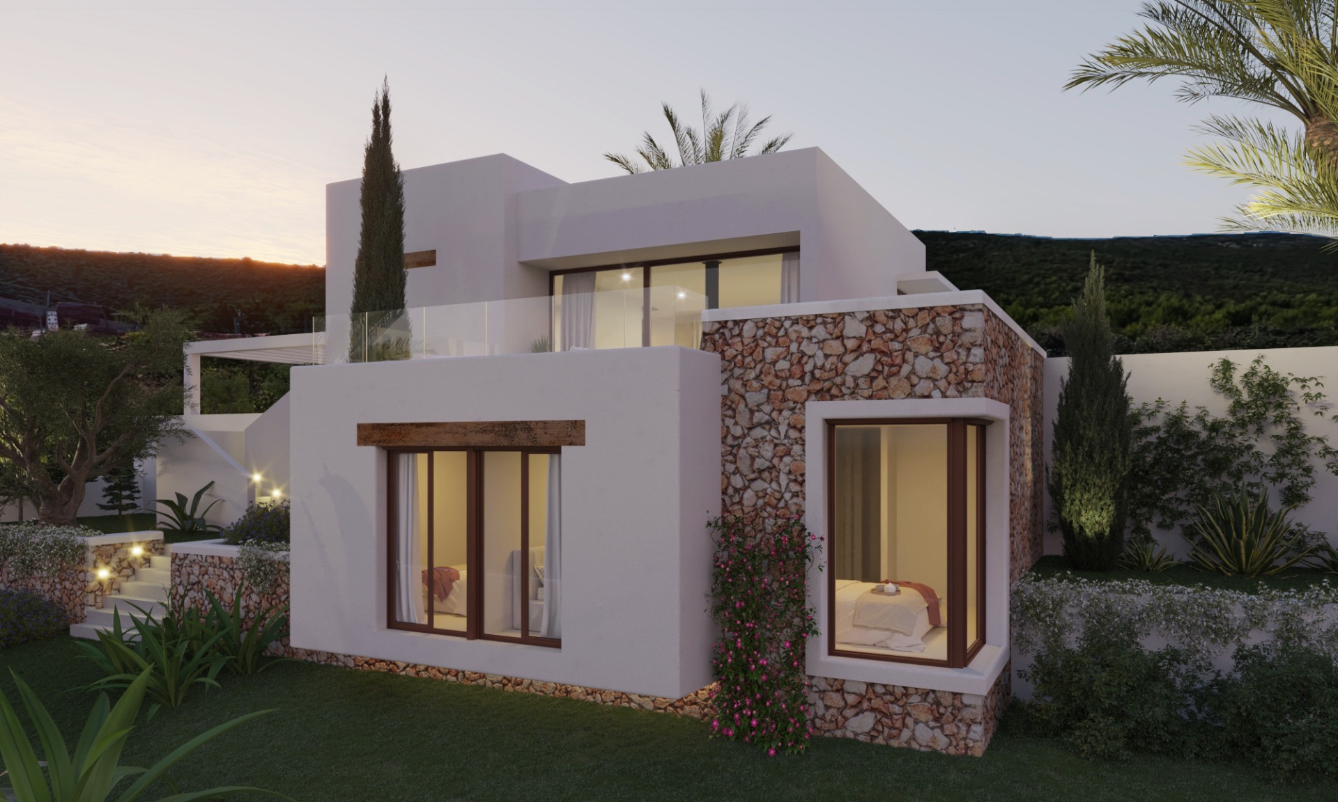 Vista exterior de una villa moderna de dos niveles con muros de piedra natural y fachada blanca. Grandes ventanales y barandillas de cristal se integran en el jardín paisajístico iluminado.