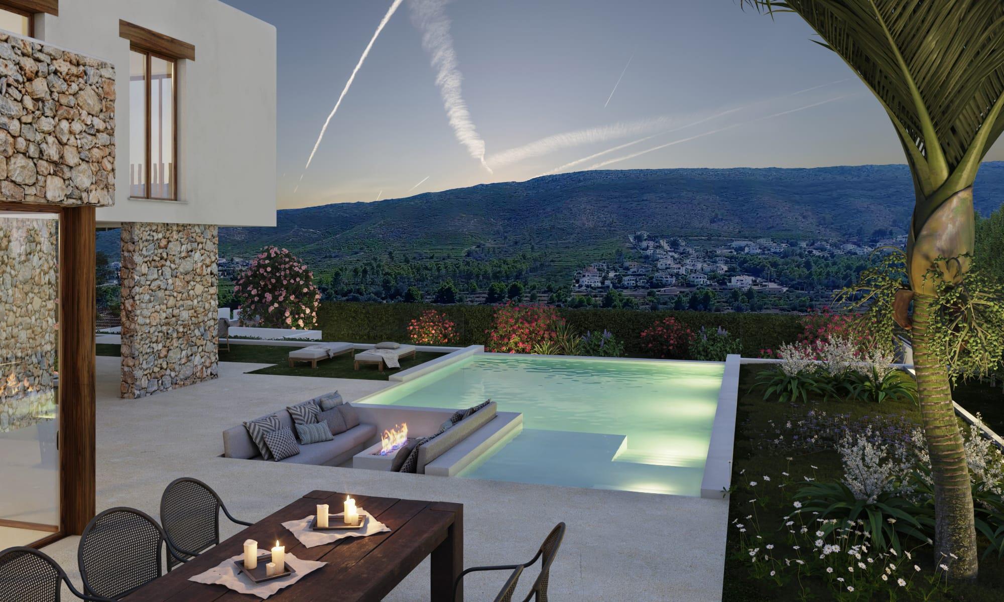 Terraza exterior con piscina infinity iluminada, zona de estar hundida con chimenea de gas y vistas panorámicas al valle de Jávea al atardecer.